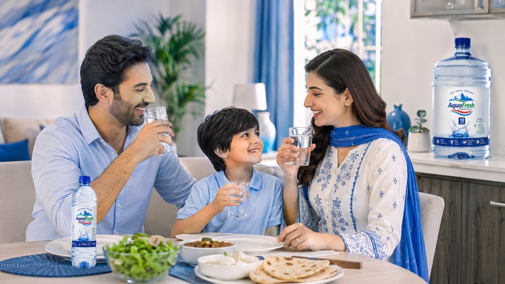 Happy family enjoying Aqua Fresh drinking water together